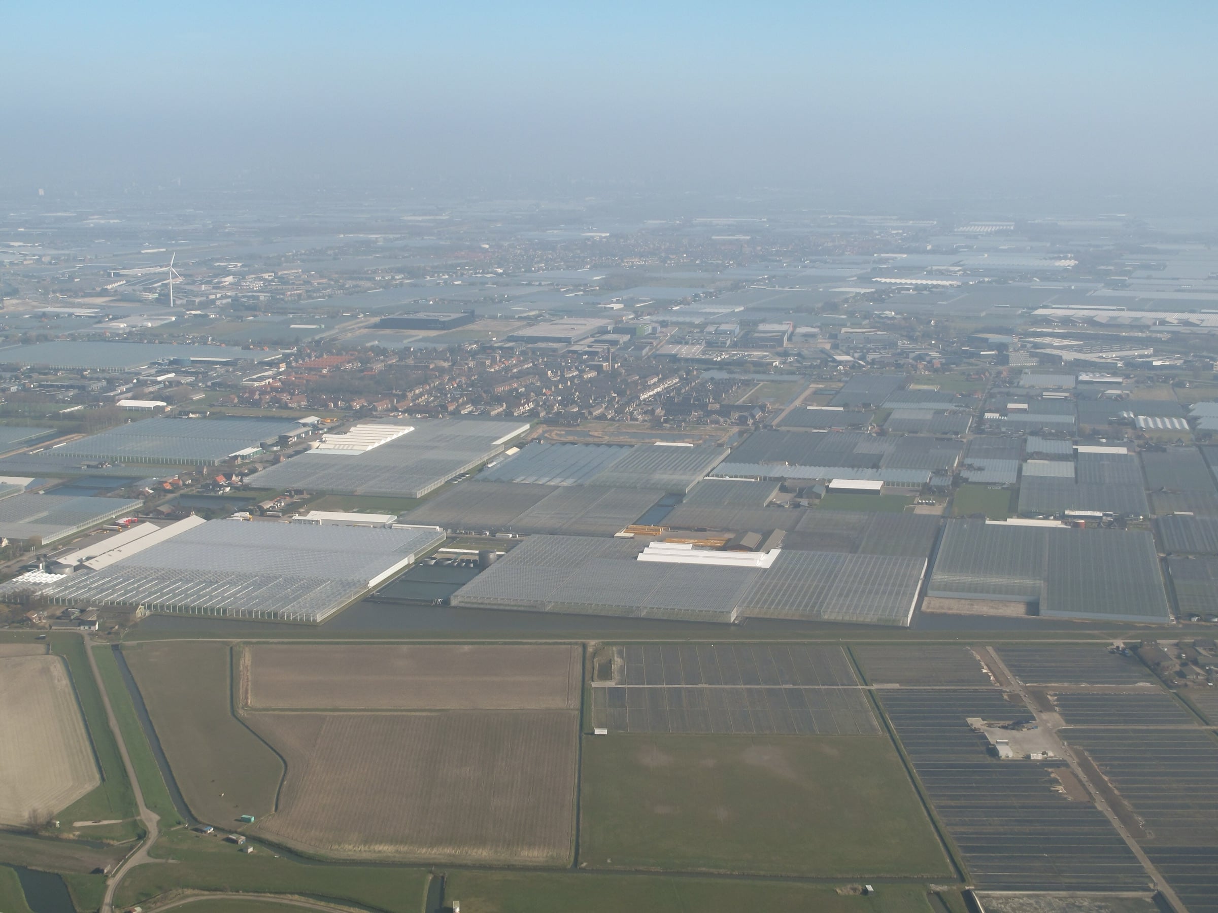 Glasshouses covering the landscape to the horizon in the Westland, Netherlands